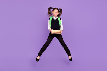 Fototapeta na wymiar Photo of funny crazy schoolgirl jump hold pile book wear bag glasses uniform isolated purple color background