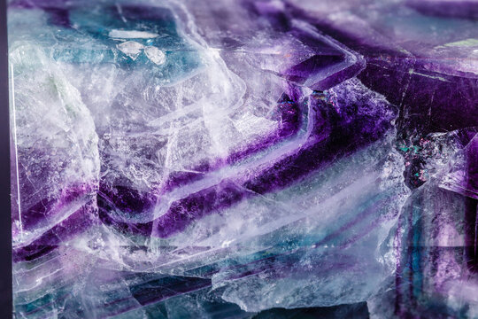 Macro mineral stone Fluorite crystal on a black background