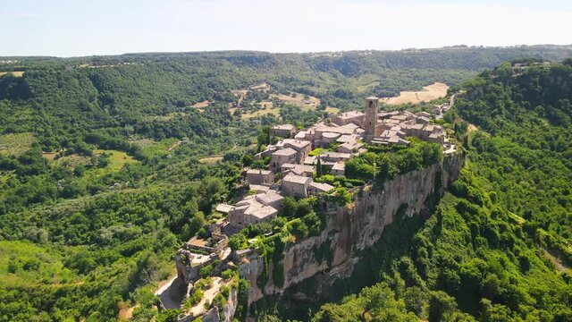 Panoramic aerial view of Civita di Bagnoregio, medieval town perched on a mountain, Italy