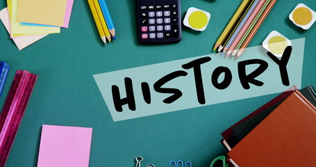 Image of history text over school items on desk