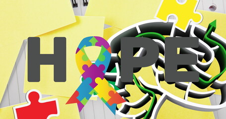 Image of puzzles falling over human brain with maze, hope text and ribbon formed with puzzles