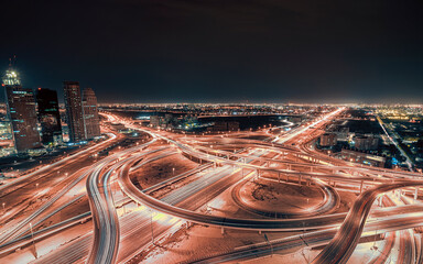 Night time aerial picture of the Sheikh zayed road traffic overpass with cars driving on the...