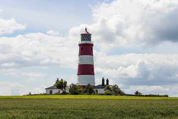 Fototapeta na wymiar Red and white lighthouse at Happisburgh