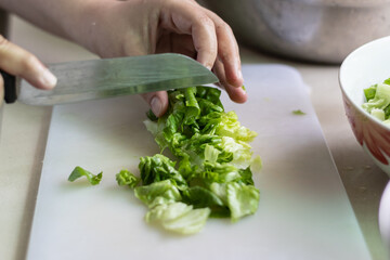 Local lifestyle housewife cut vegetables preparing for cook