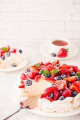 Delicious Pavlova cake with fresh strawberry and blueberry