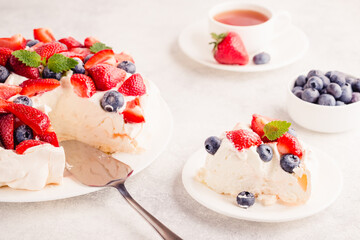 Delicious Pavlova cake with fresh strawberry and blueberry