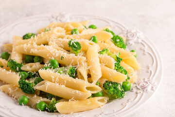 Pasta with green peas, broccoli and parmesan cheese.