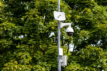 CCTV camera on metal pole in public park