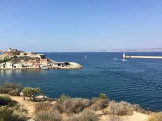 Obraz premium Panoramic view of the entrance to the Great Seaport of Marseille (Grand port maritime de Marseille, Marseille Fos Port) as well as to the Old Port (Vieux Port), seen from Pharo Palace in Marseille.