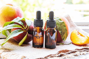 Peach seed oil in a bottle. Selective focus.