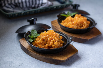 Korean instant noodles cheese flavor in a black cup