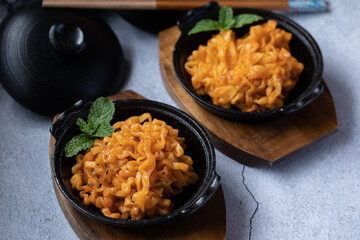 Korean instant noodles cheese flavor in a black cup