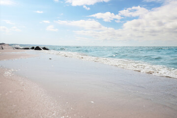 Fototapeta premium Tropical sandy beach washed by sea on sunny day