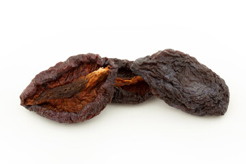 Dried plums isolated on white background