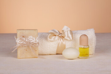 SPA set. Body brush, aroma oil, handmade soap on a beige background