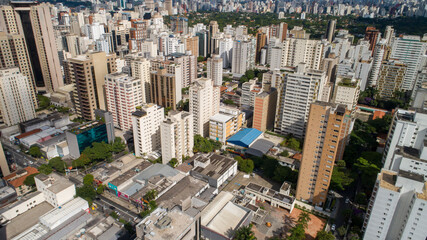 Fototapeta premium Aerial view of Sao Paulo city. Prevervetion area with trees and green area of Ibirapuera park in Sao Paulo city, Brazil