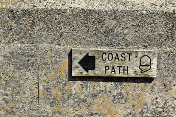 wooden sign for the Coast path located at Slapton beach