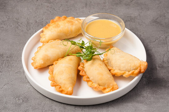 small pies posikunchiki on a white plate