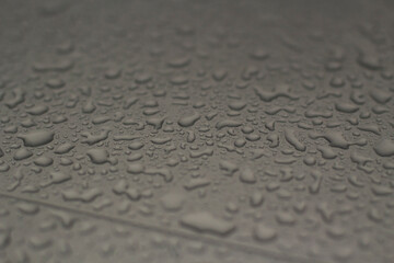 Drops of water on the glass. The texture of large raindrops on the surface.