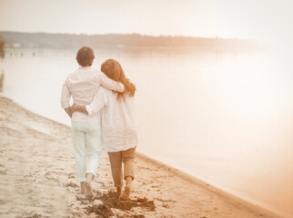 Couple walk sea, great design for any purposes. Healthy active lifestyle. Elderly couple. Blue sky. Elderly people.