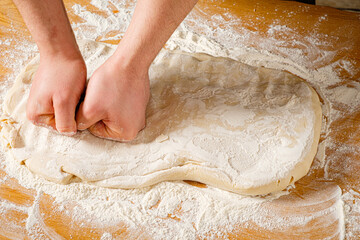 chef making pizza on the table