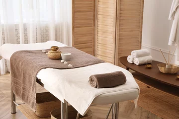 Fotobehang Stylish room interior with massage table in spa salon © New Africa