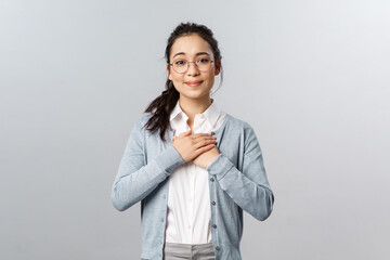 Portrait of touched, heartwarming lovely asian woman in glasses, listening to her students...