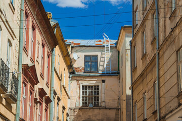 Fototapeta premium old city back street houses walls corner with symmetry background facade view