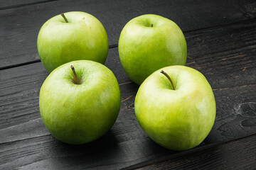 Granny smith apple, on black wooden table background