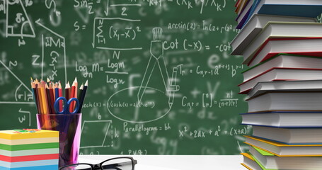 School stationary items and glasses against mathematical equations floating on green background