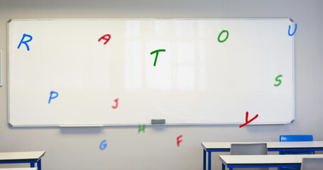 Digital composition of multiple colorful alphabets floating against white board in empty classroom