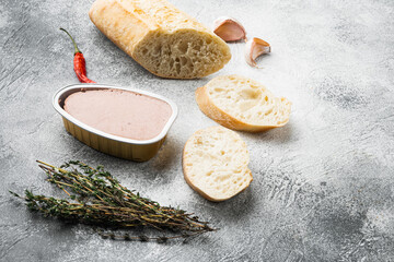 Chicken liver pate sandwich baguette, on gray stone table background, with copy space for text