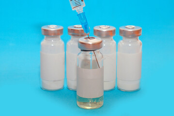 vaccine, medicine, vial, syringe for injection. Vaccination, treatment for coronavirus Covid 19. Unbranded