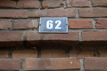 Fototapeta na wymiar Close Up House Number 62 At Amsterdam The Netherlands 6-8-2021
