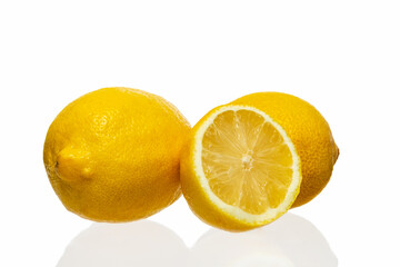Obraz na płótnie Canvas Lemons and half-lemon on a white background. Isolate on white. Photo
