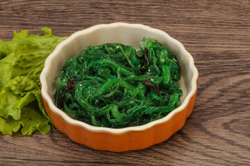Green Chuka Seaweed Salad Isolated on White Background Top View. Wakame Sea Kelp Salat