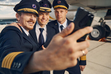 Handsome aviators posing together for the camera