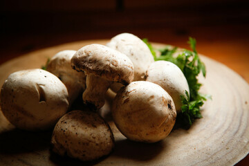 Some mushrooms in a wood table. 