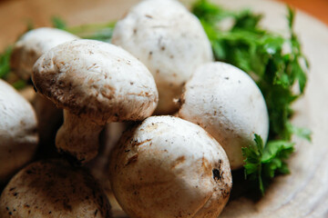 Some mushrooms in a wood table. 