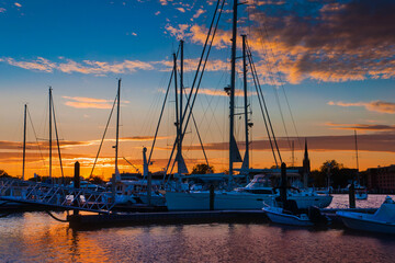 Sunset over boats in a marina in Annapolis, Maryland.