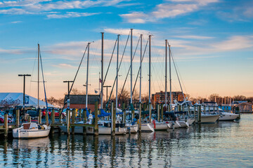 Sailboats in a marina at sunset along the waterfront in Annapolis, Maryland.