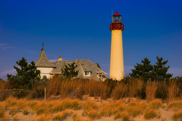 Evening light on the Cape May Point Lighthouse, Cape May, New Jersey - obrazy, fototapety, plakaty