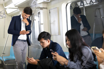 Fototapeta na wymiar businessman using smartphone in a underground train