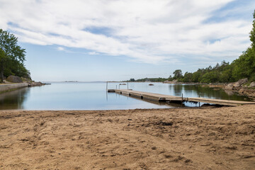 Fototapeta na wymiar Wooden jetty at Kolleviks beach, Karlshamn, Sweden