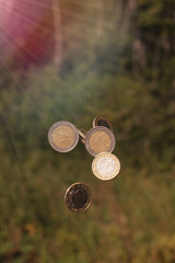 euro coins in air