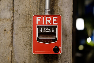 red fire alarm on wall