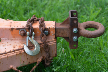 old rusty anchor, or close up of a trailer hitch