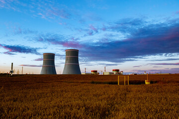 Fototapeta na wymiar Breathtaking picturesque evening view of the nuclear power plant in Ostrovets, Belarus.