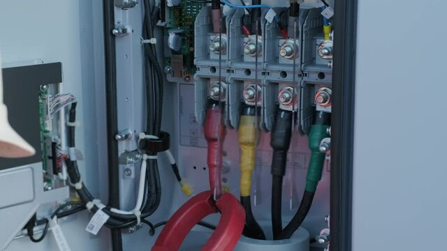 Checking the operating voltage levels of the solar panel switchgear compartment