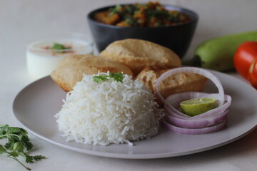 North Indian vegetarian meals. One pot preparation of lentil and bottle gourd served with steamed basmati rice and deep fried whole wheat Indian flat bread.